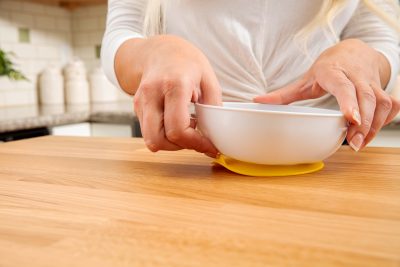 Lifestyle_No_Slip_Suction_Bowl_On_Counter_Pull_Tab_Yellow_Front
